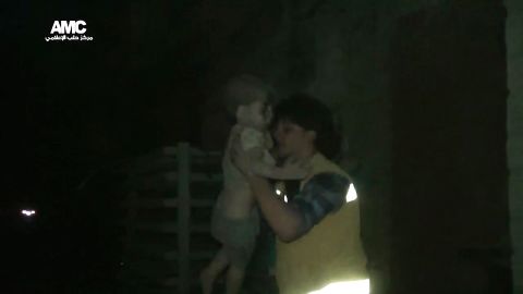 A civil defense worker carries Omran into the ambulance. The airstrike destroyed Omran's home, where he lived with his parents and two siblings. Director of the Aleppo Media Center Yousef Saddiq said Omran's 10-year-old brother, Ali, <a href="http://www.cnn.com/2016/08/20/middleeast/syria-conflict/index.html" target="_blank">died from his injuries</a> on Saturday, August 20.
