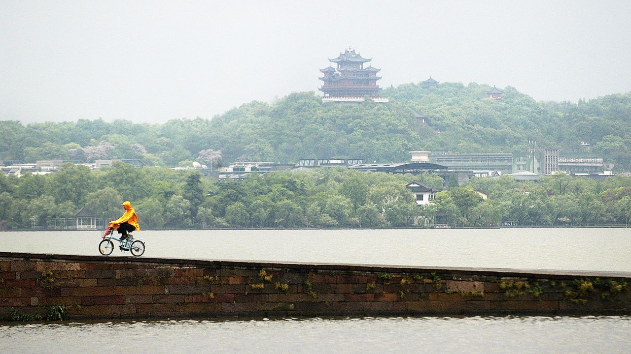 While the rest of the country is moving from two wheels to four, cycling culture is thriving in Hangzhou. The city has the world's biggest public bike system, offering more than 84,000 bicycles for rent. 