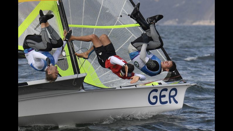 Germany's Erik Heil and Thomas Ploessel celebrate winning bronze in the 49er class.