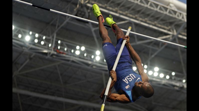 U.S. decathlete Ashton Eaton competes in the pole vault. He went on to win the decathlon, <a href="index.php?page=&url=http%3A%2F%2Fwww.cnn.com%2F2016%2F08%2F18%2Fsport%2Fashton-eaton-decathlon-rio%2Findex.html" target="_blank">defending his Olympic title</a> from 2012.