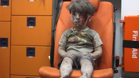 5-year-old wounded Syrian kid Omran Daqneesh sits alone in the back of the ambulance in Aleppo. 