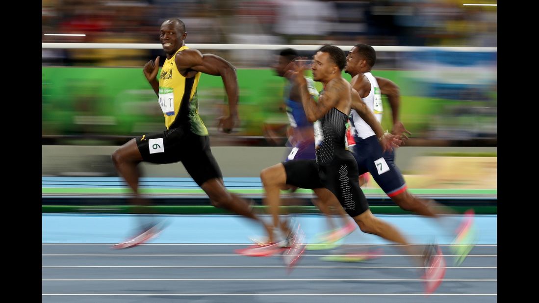 <strong>August 14:</strong> Jamaican sprinter Usain Bolt looks back at his Olympic competitors during a 100-meter semifinal. Bolt <a href="http://www.cnn.com/2016/08/14/sport/usain-bolt-justin-gatlin-olympic-games-100-meters-rio/" target="_blank">won the final a short time later,</a> becoming the first man in history to win the 100 meters at three straight Olympic Games.