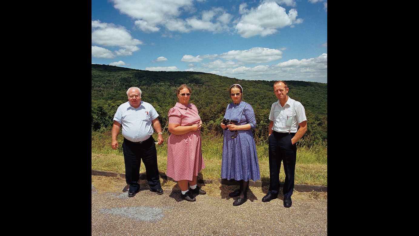 <em>Two Hutterite couples at Shenandoah National Park, Virginia, 1999. </em>Color drives the series, which Minick realized after first photographing sightseers in black and white.
