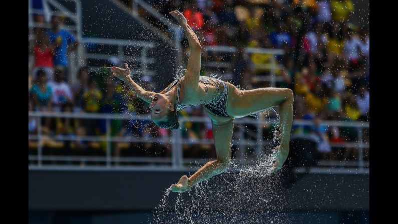 Synchronized swimmers from Russia perform their technical routine.
