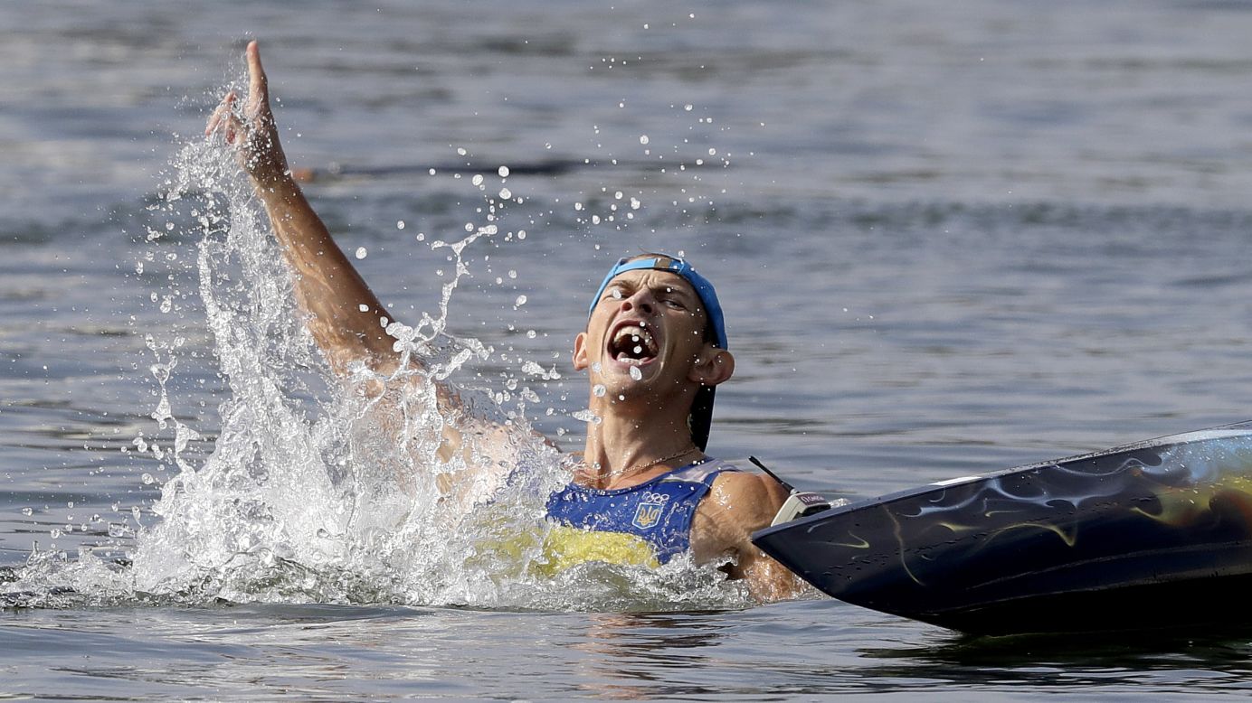 Ukrainian canoeist Yuriy Cheban celebrates gold in the C-1 200-meter sprint.