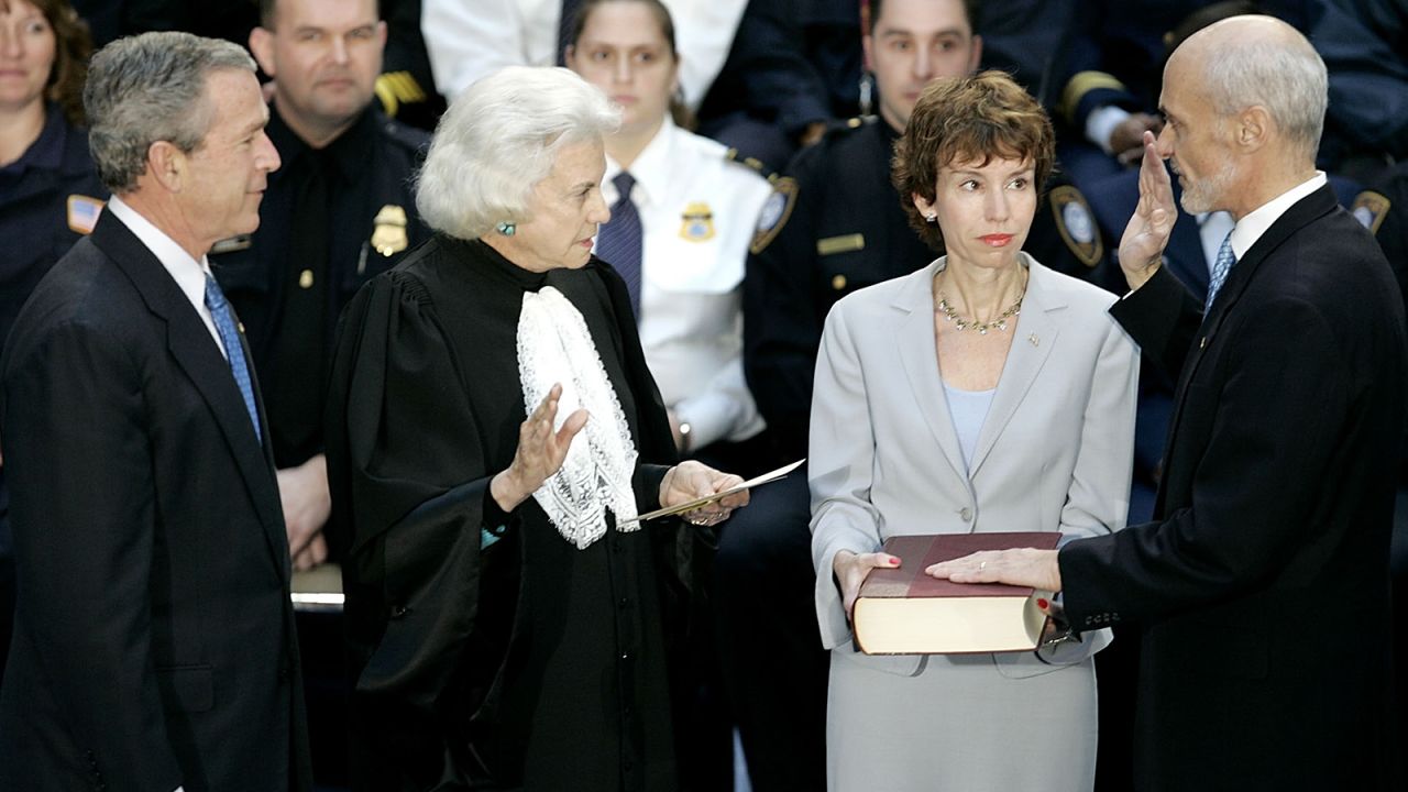 President George W. Bush, left, watches as Homeland Security Secretary Michael Chertoff, right, is sworn in by O'Connor in March 2005. Chertoff's wife, Meryl, is holding the Bible.