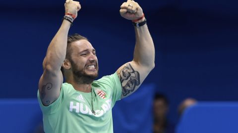 Hosszu's coach husband Shane Tusup celebrates after his wife broke the world record to win the women's 400m individual medley final.