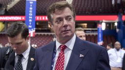 Trump campaign chairman Paul Manafort walks around the convention floor before the opening session of the Republican National Convention in Cleveland. Hillary Clinton's campaign is questioning Donald Trump's top political aide's ties to a pro-Kremlin political party in Ukraine, claiming it is evidence of the Republican nominee's cozy relationship with Russia. The New York Times reported that handwritten ledgers found in Ukraine show $12.7 million in undisclosed payments to Paul Manafort from the pro-Russia party founded by the country's former president Viktor Yanukovych.
