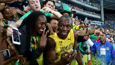 Fans' favorite: Usain Bolt takes time to pose for selfies after winning the 200-meters in Rio