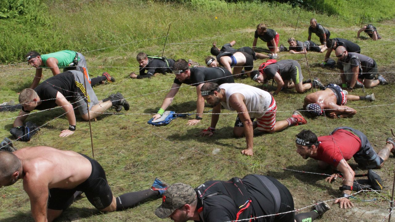 The barbed wire crawl is a signature Spartan obstacle.