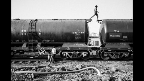 Jaldoot Express, a train bringing in water from Meraj, India, is emptied at the railway station in Latur.