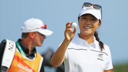 Lydia Ko of New Zealand poses with the golf ball she used to make a hole-in-one in Rio.