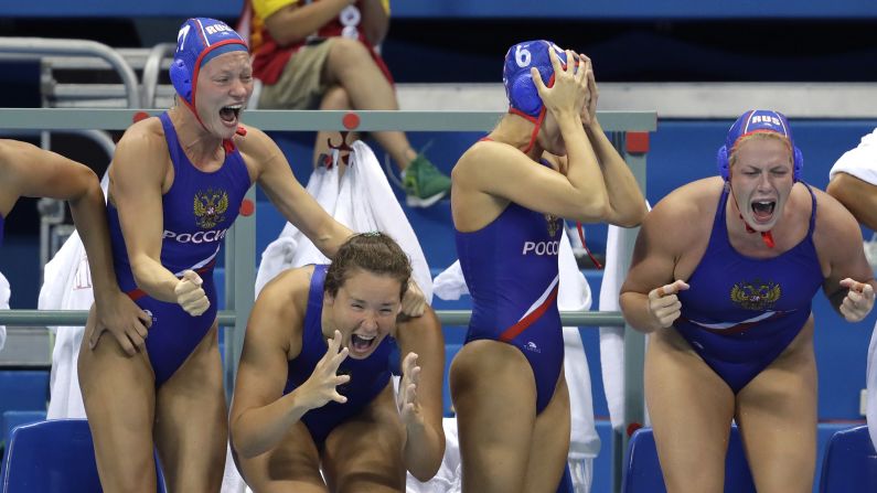 Members of Russia's water polo team celebrate after defeating Hungary to win the the bronze.