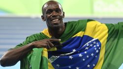 Jamaica's Usain Bolt celebrates his team's victory at the end of the Men's 4x100m Relay Final during the athletics event at the Rio 2016 Olympic Games at the Olympic Stadium in Rio de Janeiro on August 19, 2016.   / AFP / Eric FEFERBERG        (Photo credit should read ERIC FEFERBERG/AFP/Getty Images)