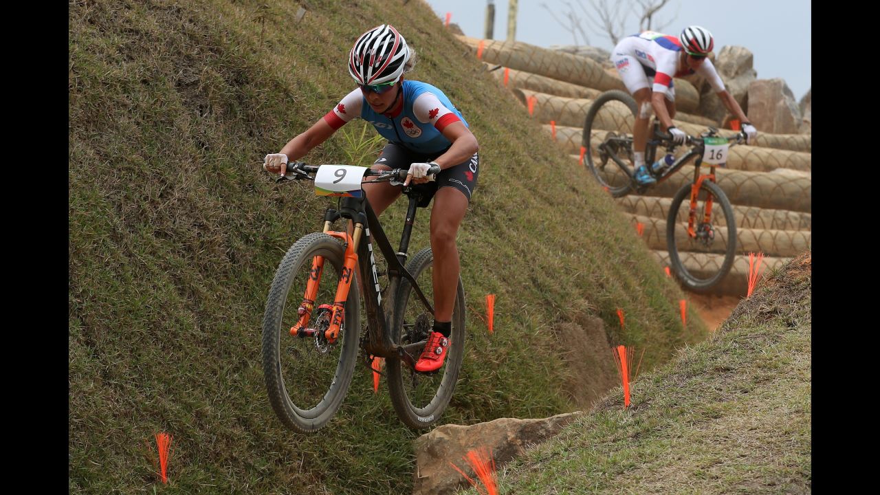 Emily Batty of Canada, left, and Katerina Nash of the Czech Republic compete in the cross-country mountain bike race.