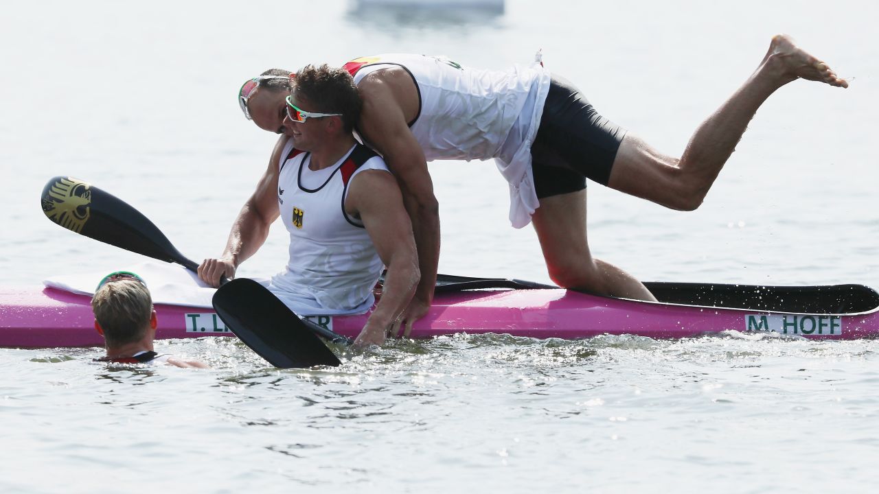 Canoeists Tom Liebscher, left, and Max Hoff of Germany react after winning the K-4 1,000-meter sprint. Marcus Gross and Max Rendschmidt were also part of the gold-medal finish.