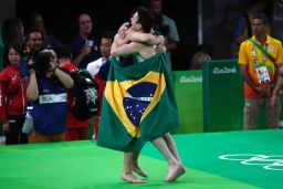 Brazil's Arthur Mariano (L) and Diego Hypolito celebrate in style