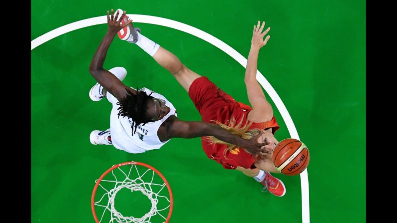 U.S. basketball player Tina Charles, left, and Spain's Laura Gil battle for the ball in the final game on Saturday, August 20. The Americans earned yet another gold, making it their <a  target="_blank">sixth straight Olympic win</a>.