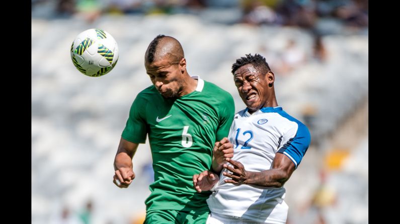 Nigeria's William Ekong, left, and Romell Quioto of Honduras jump for a header during their bronze medal soccer match. The Nigerian team won its country's first Olympic medal since the Beijing 2008 Games and its third soccer medal in its history.