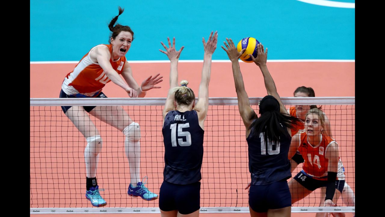 Volleyball players from the Netherlands, in orange, and the United States compete in the bronze medal match. The Americans won.
