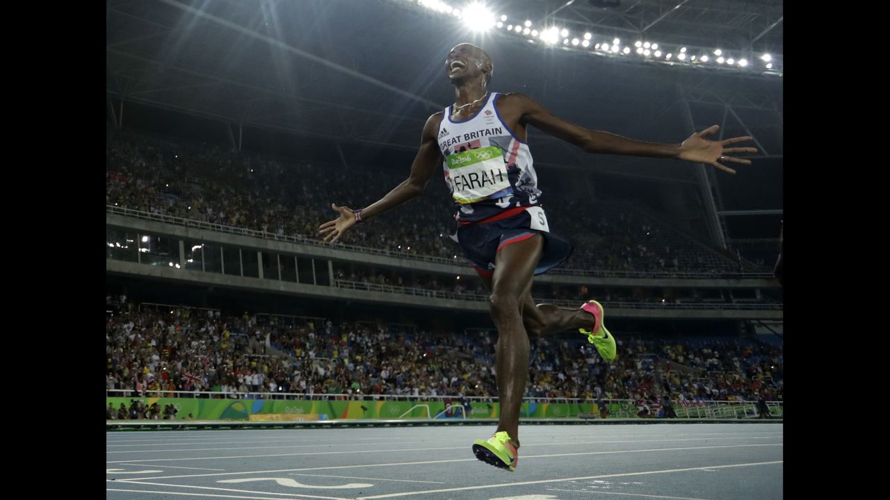 Britain's Mo Farah crosses the line to win the gold medal in the men's 5,000-meter final.