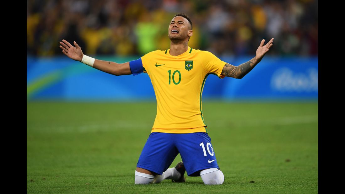 Neymar of Brazil becomes emotional after scoring the winning penalty in a shoot against Germany during the men's football final.