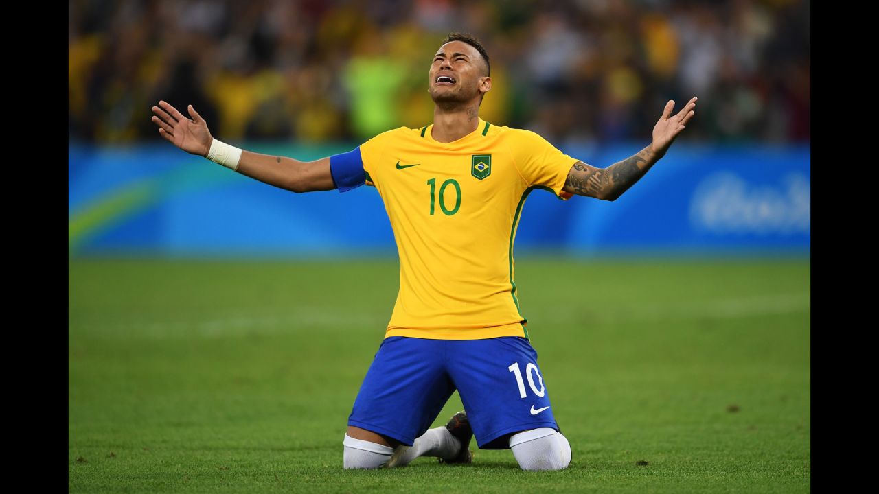 Neymar of Brazil becomes emotional after scoring the winning penalty in a shoot against Germany during the men's football final.
