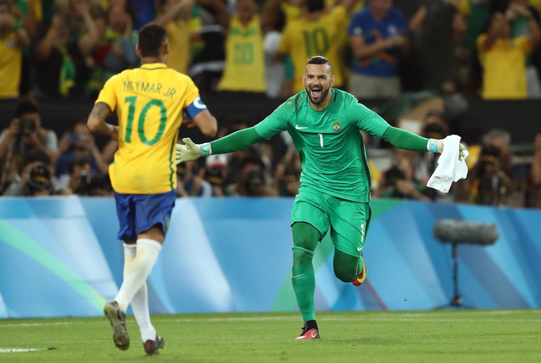 Brazil goalkeeper Weverton celebrates with Neymar at the Maracana Stadium.