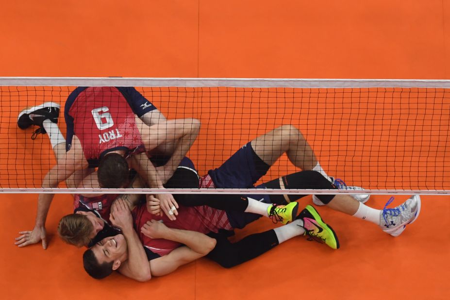 U.S. volleyball players celebrate after winning bronze in a game against Russia.