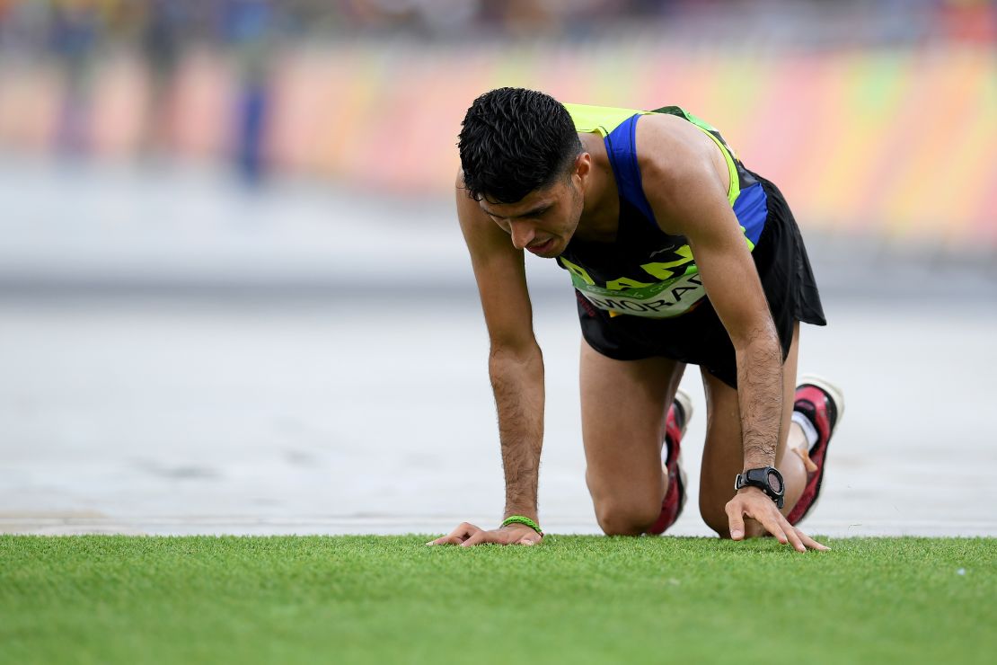 Iran's Mohammad Jafar Moradi struggles to finish the marathon.