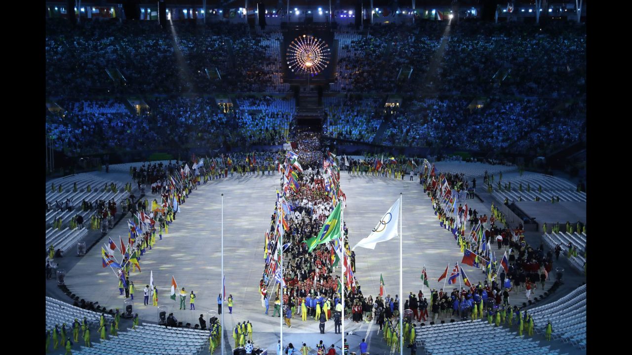 Athletes enter the stadium.