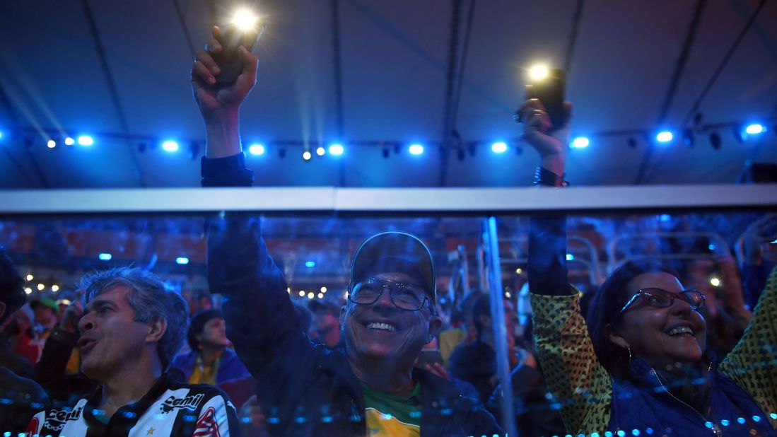 Spectators watch the closing ceremony.