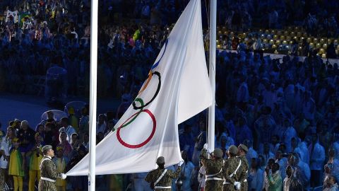 The Olympic flag is lowered.