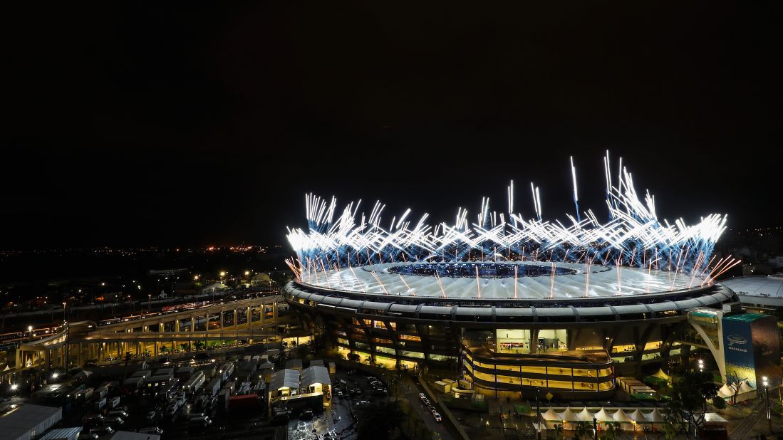 Fireworks explode over the stadium.