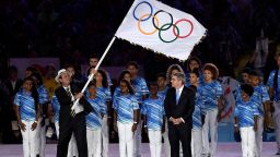 RIO DE JANEIRO, BRAZIL - AUGUST 21:  Mayor of Rio de Janeiro Eduardo Paes (L) waves the IOC flag prior to hand to IOC President Thomas Bach (R) on stage at the Flag Handover Ceremony during the Closing Ceremony on Day 16 of the Rio 2016 Olympic Games at Maracana Stadium on August 21, 2016 in Rio de Janeiro, Brazil.  (Photo by Pascal Le Segretain/Getty Images)