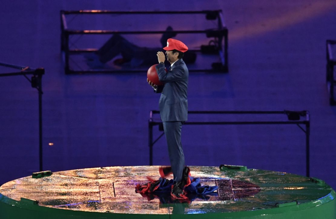 Shinzo Abe, dressed as Super Mario, holds a red ball during the closing ceremony of the Rio 2016 Olympic Games.