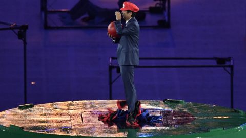 Shinzo Abe, dressed as Super Mario, holds a red ball during the closing ceremony of the Rio 2016 Olympic Games.