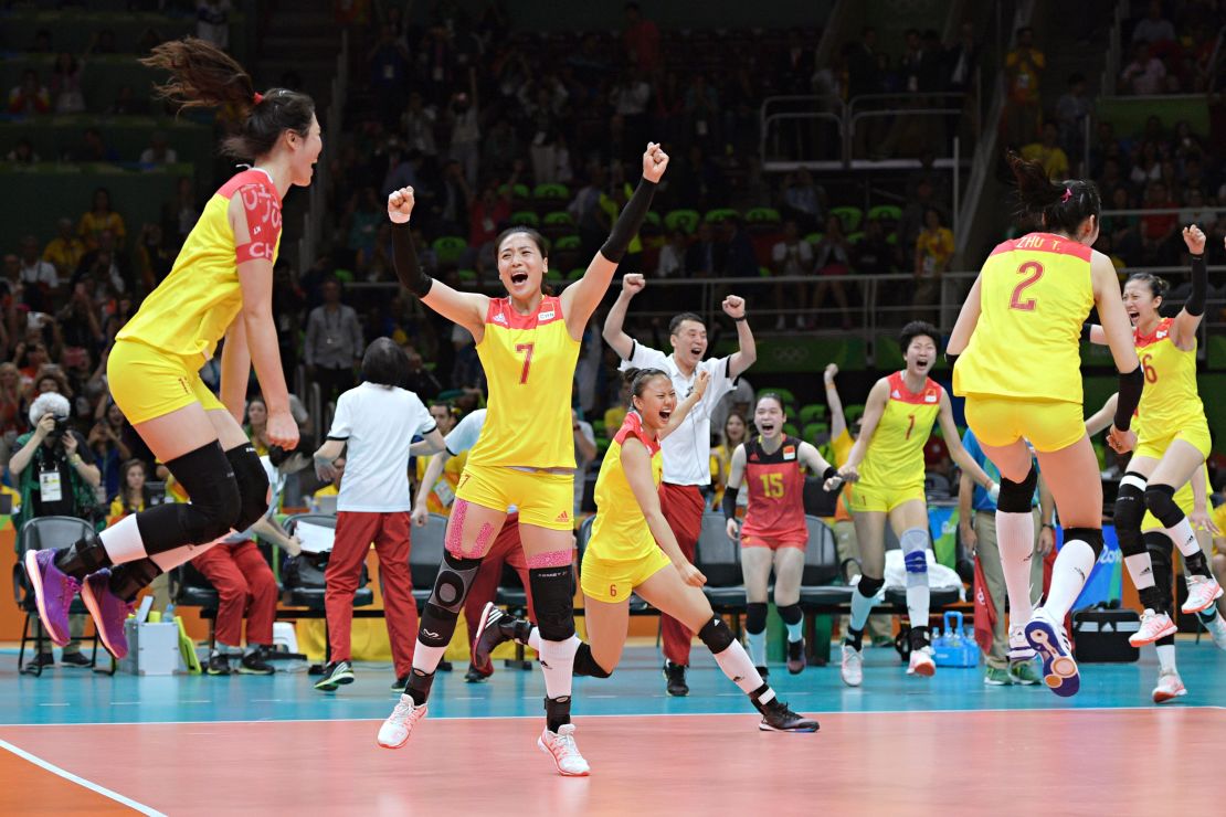 China's players celebrate after winning their women's gold medal volleyball match against Serbia on August 20, 2016, at the Rio 2016 Olympic Games.