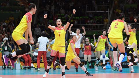 China's players celebrate after winning their women's gold medal volleyball match against Serbia on August 20, 2016, at the Rio 2016 Olympic Games.