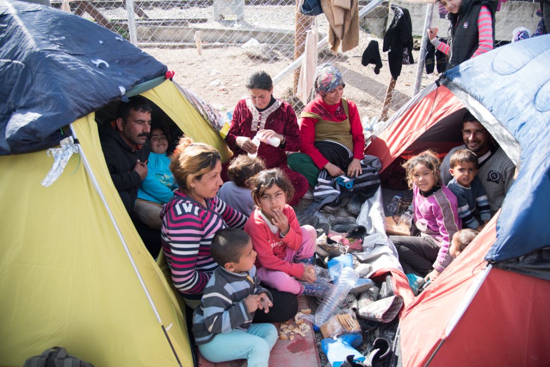 Families shelter in tents at a camp in Greece. 