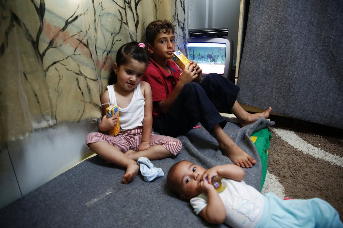 Tuba (pictured far right with siblings Abdulah and Jehna) was just 20 days old when her family fled Syria in a boat to Greece.  