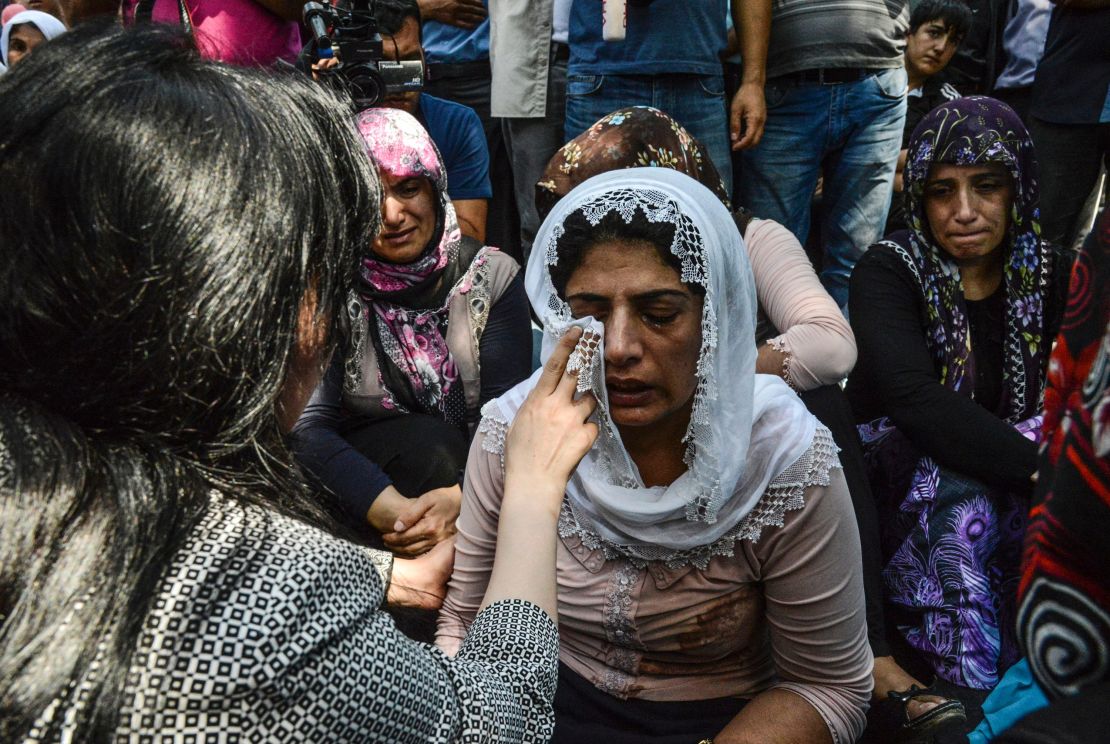Mourners weep at a funeral Sunday for victims of the bombing in the southern Turkish city.