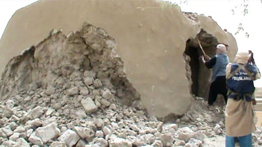 A still from a video shows Islamist militants destroying an ancient shrine in Timbuktu on July 1, 2012. Islamist rebels in northern Mali smashed four more tombs of ancient Muslim saints in Timbuktu on July 1 as the International Criminal Court warned their campaign of destruction was a war crime.  The hardline Islamists who seized control of Timbuktu along with the rest of northern Mali three months ago, consider the shrines to be idolatrous and have wrecked seven tombs in two days.    AFP PHOTO / AFP / STR        (Photo credit should read STR/AFP/Getty Images)