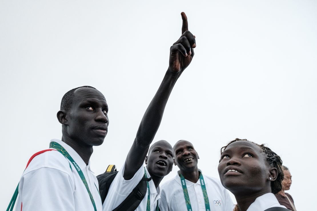 South Sudan's athletes James Nyang Chiengjiek (L), Yiech Pur Biel (2nd L) and Rose Nathike Lokonyen.