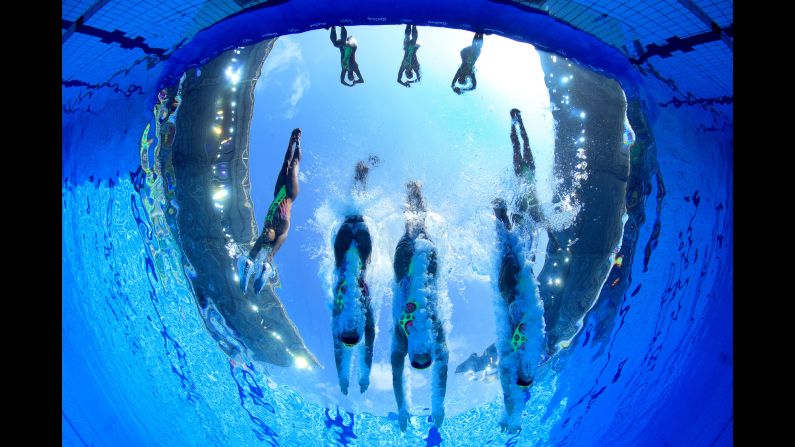 Japan's synchronized swimming team enters the pool for its technical routine on Thursday, August 18.