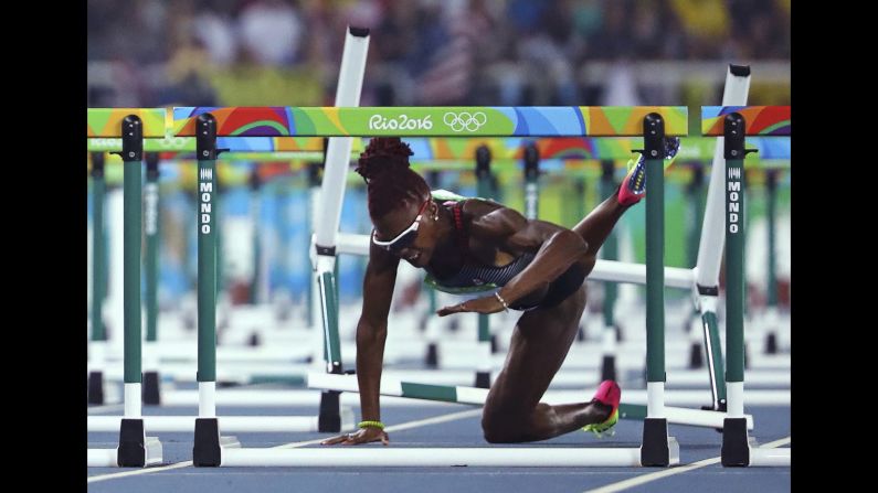 Canadian hurdler Nikkita Holder falls during the 100-meter semifinals on Wednesday, August 17.