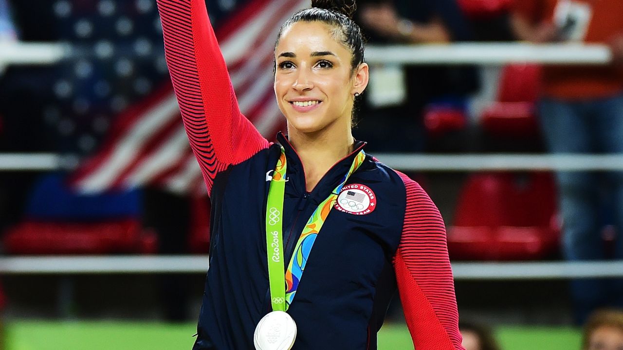 Aly Raisman celebrates on the podium after winning a silver medal at the 2016 Rio Olympics.