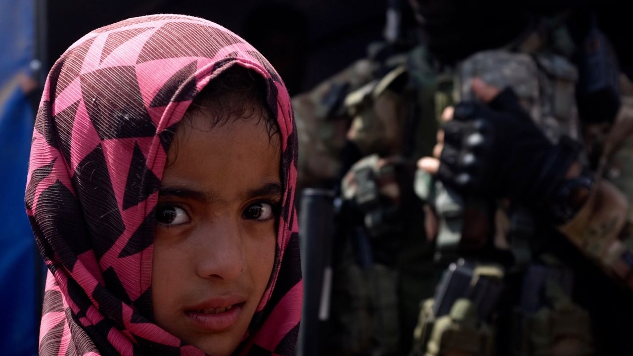 A child in a refugee camp outside al-Qayyara, Iraq, where her family has been living for a month.