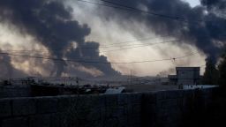Smoke rises from Qayyarah in an afternoon as ISIS burns crude oil to block visibility from above.
