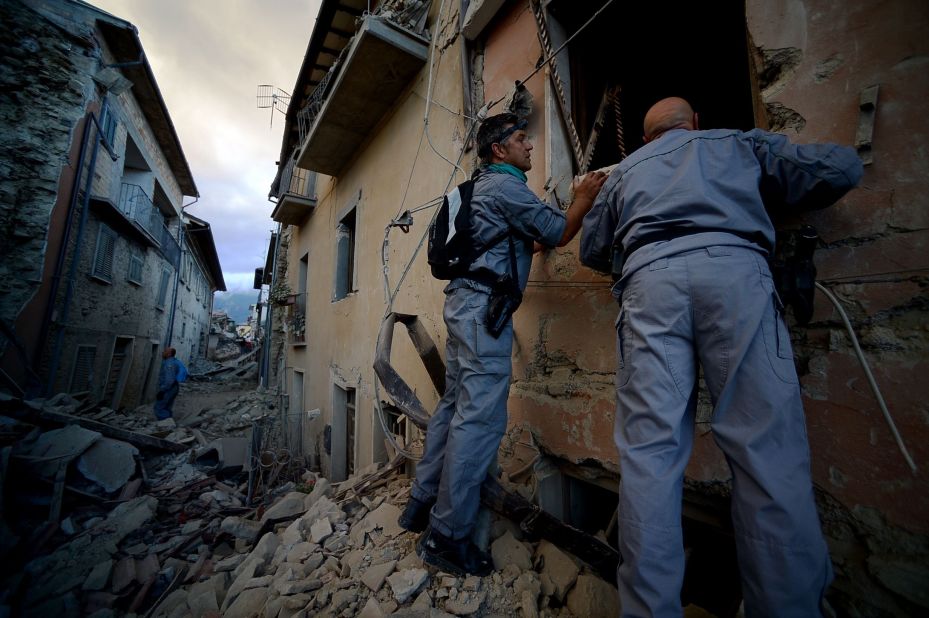 Rescuers search for victims in Amatrice on August 24.